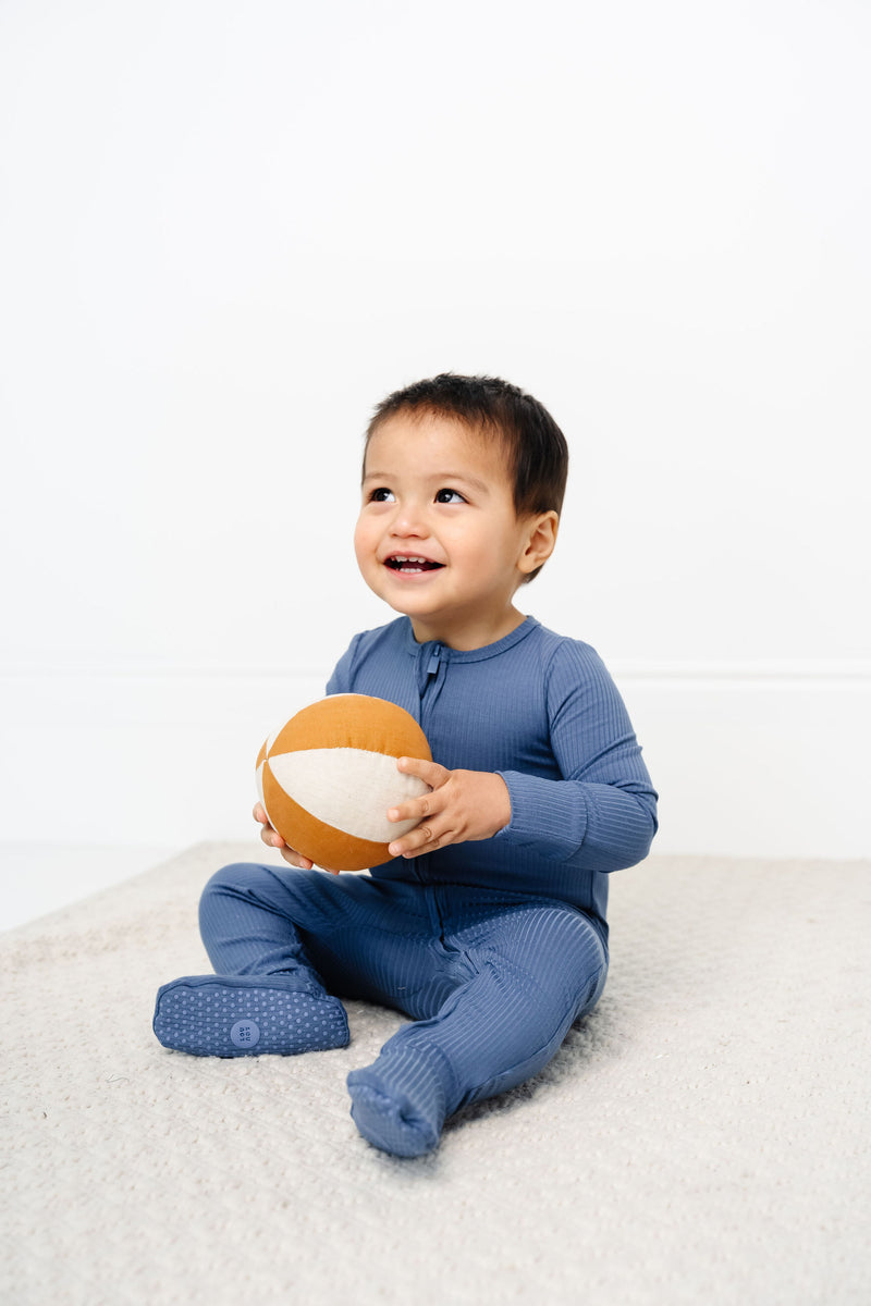 Harrison Zipper Footies Toddler Boy in 2T holding ball