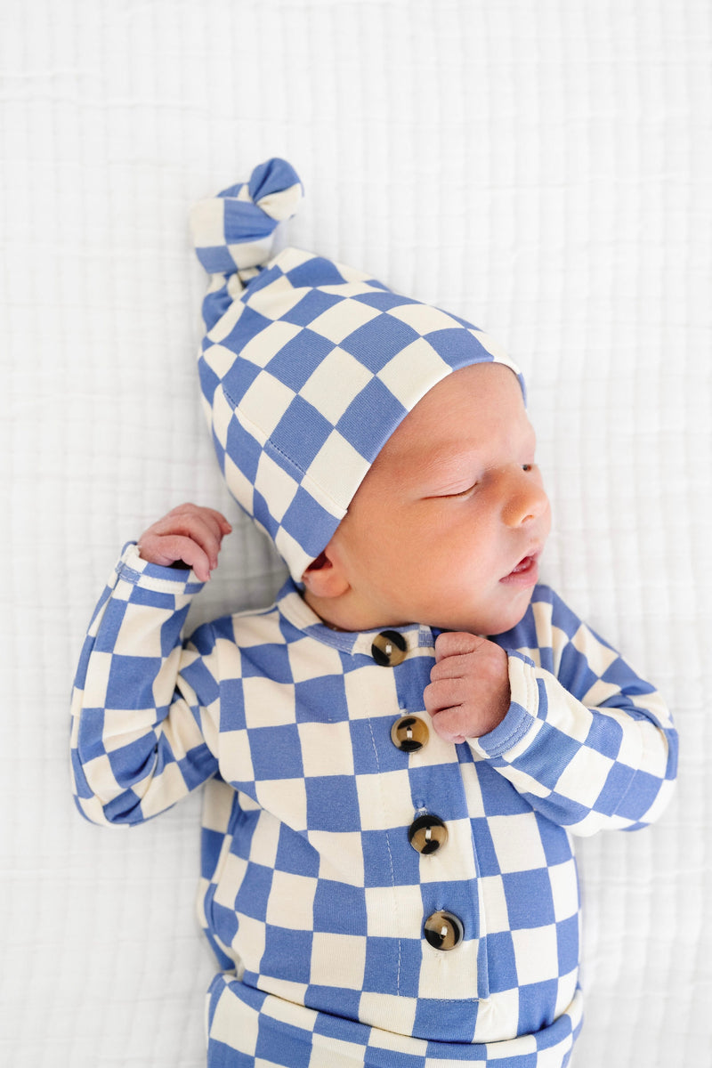 jett top and bottom and knotted gown newborn boy sleeping close up on top and bottom top with matching top knot hat