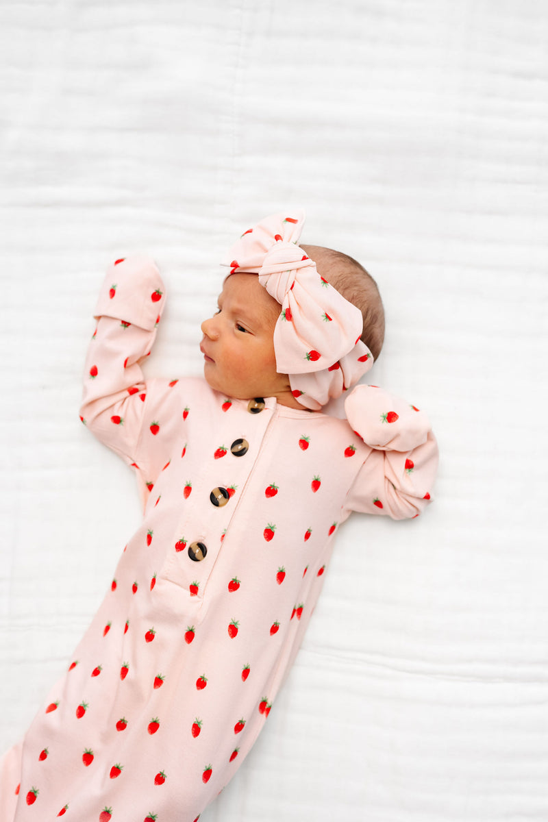 junie knotted gown strawberry print. newborn girl with matching headband