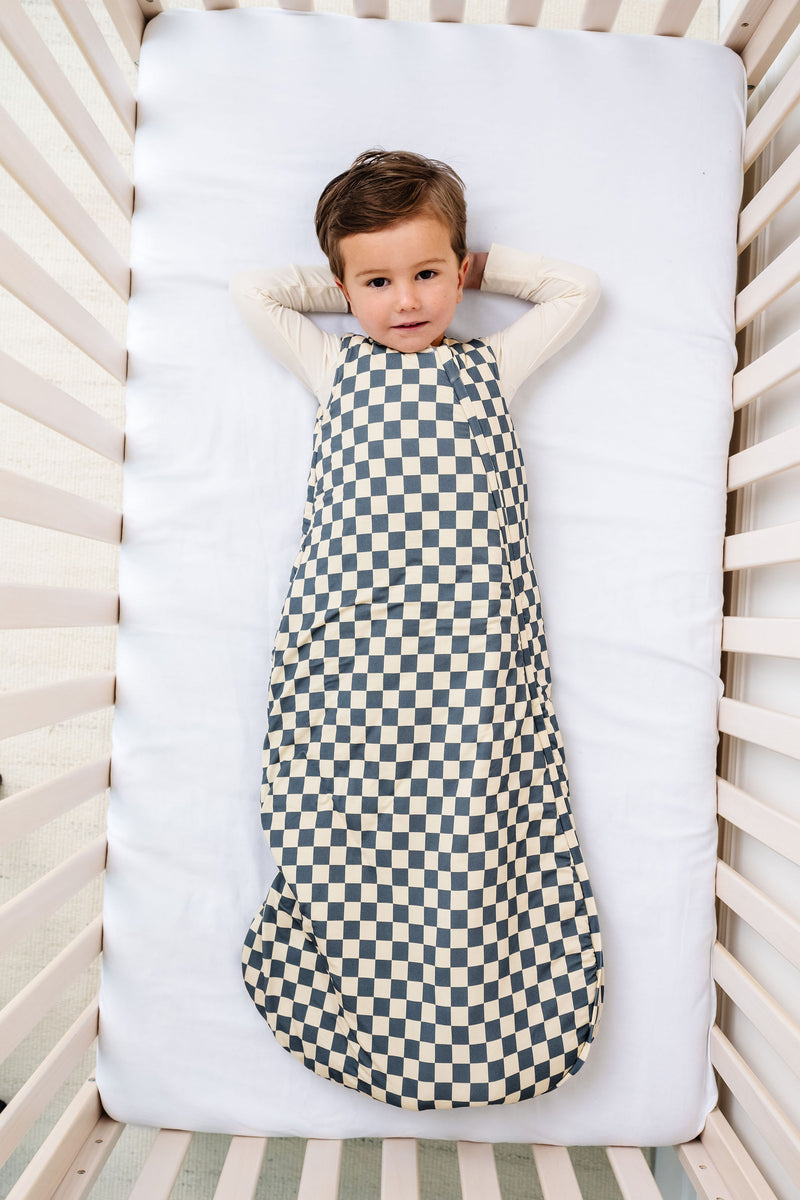 miles sleep sack toddler boy laying in crib wearing 2T