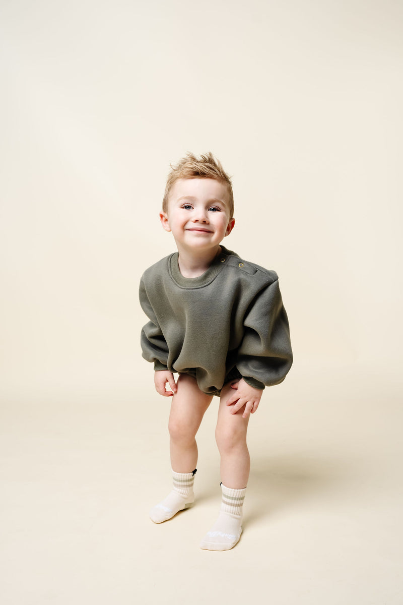 olive sweatshirt romper toddler boy standing