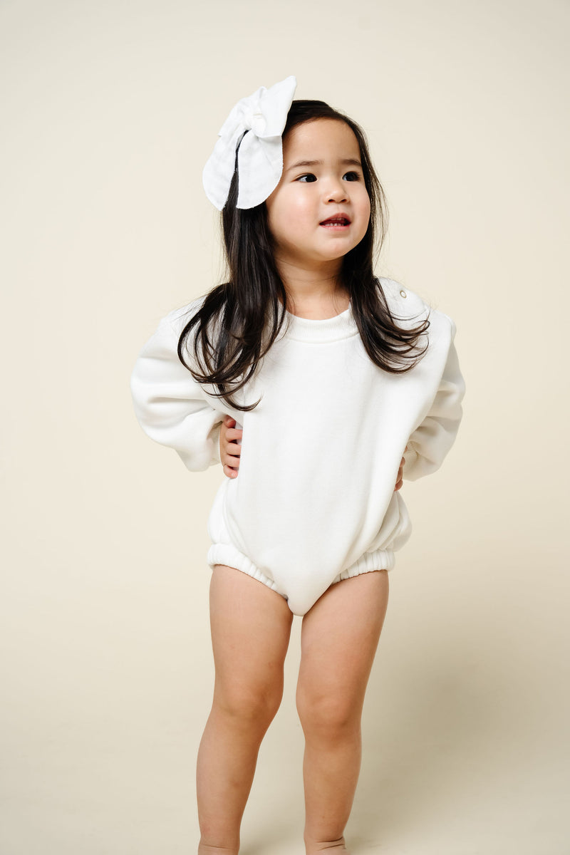 white sweatshirt romper toddler girl dark hair